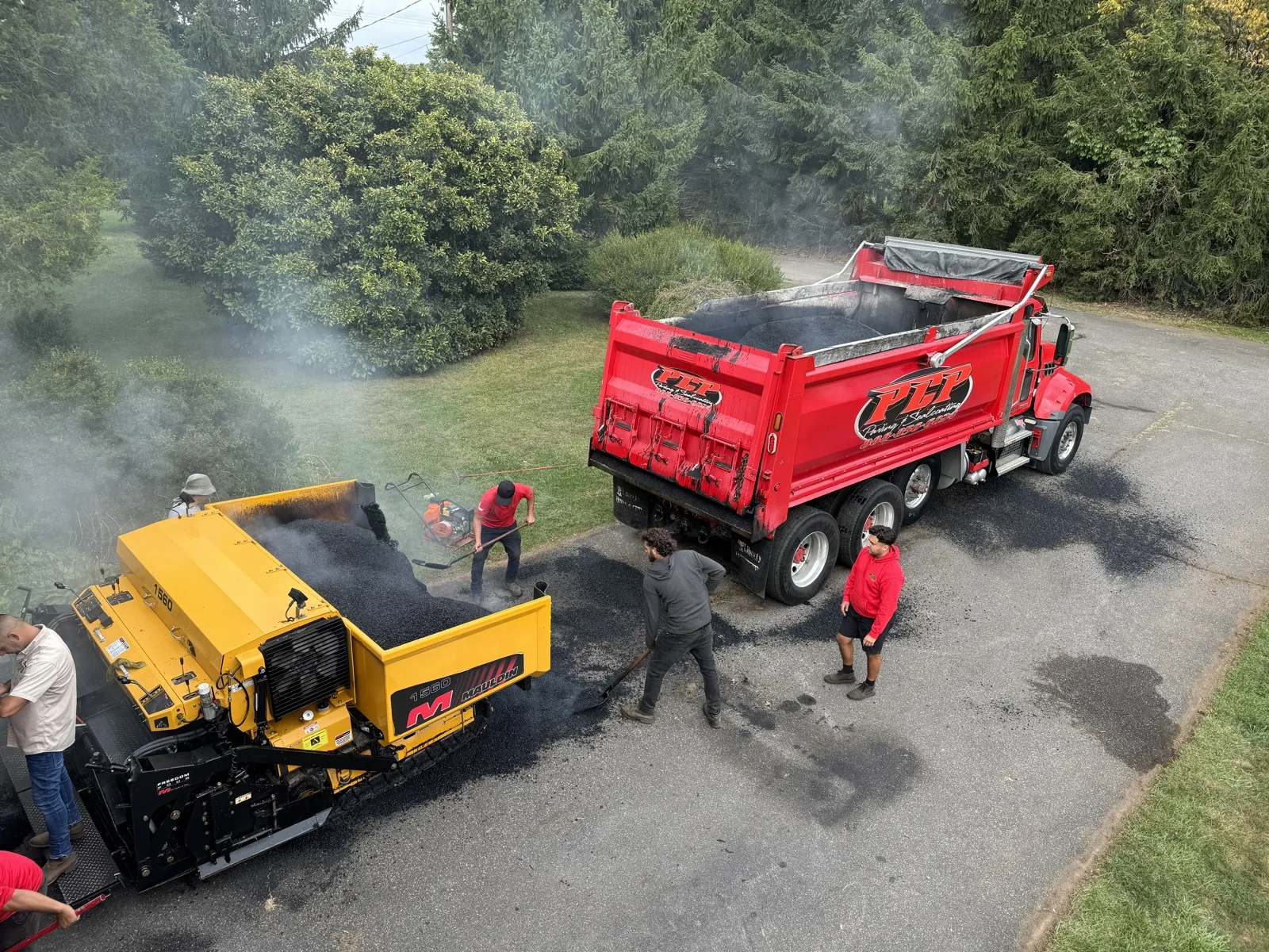 Aerial-style paver + red dump truck, All County Paving NJ and PA