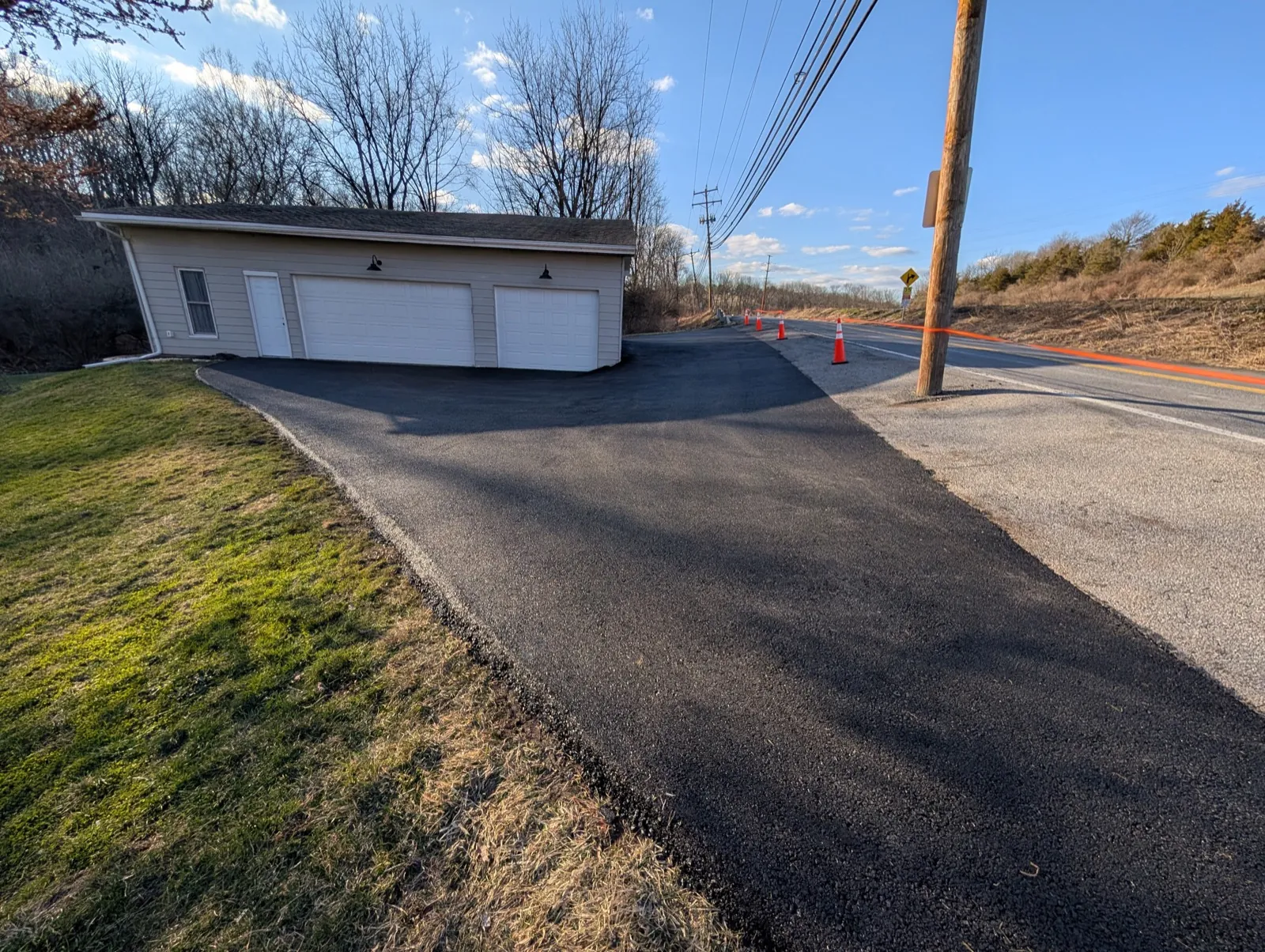 Asphalt driveway approach meeting the street