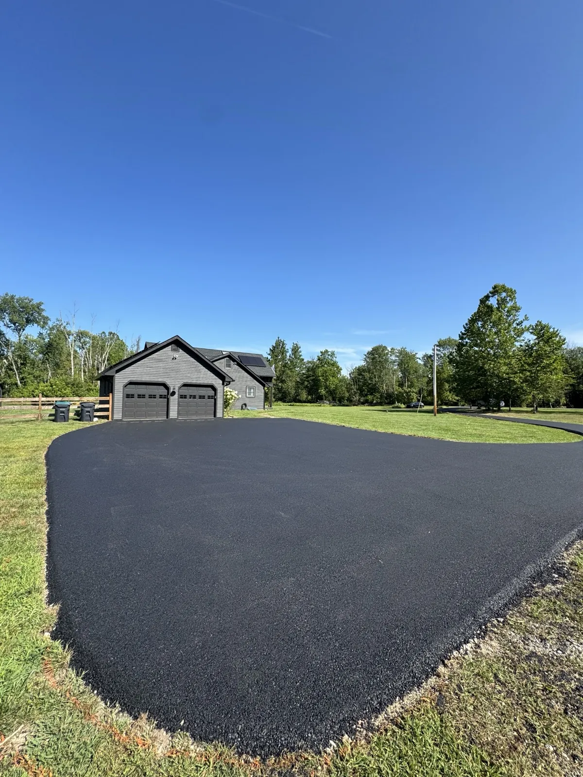 Driveway to suburban home, blue sky, All County Paving NJ and PA