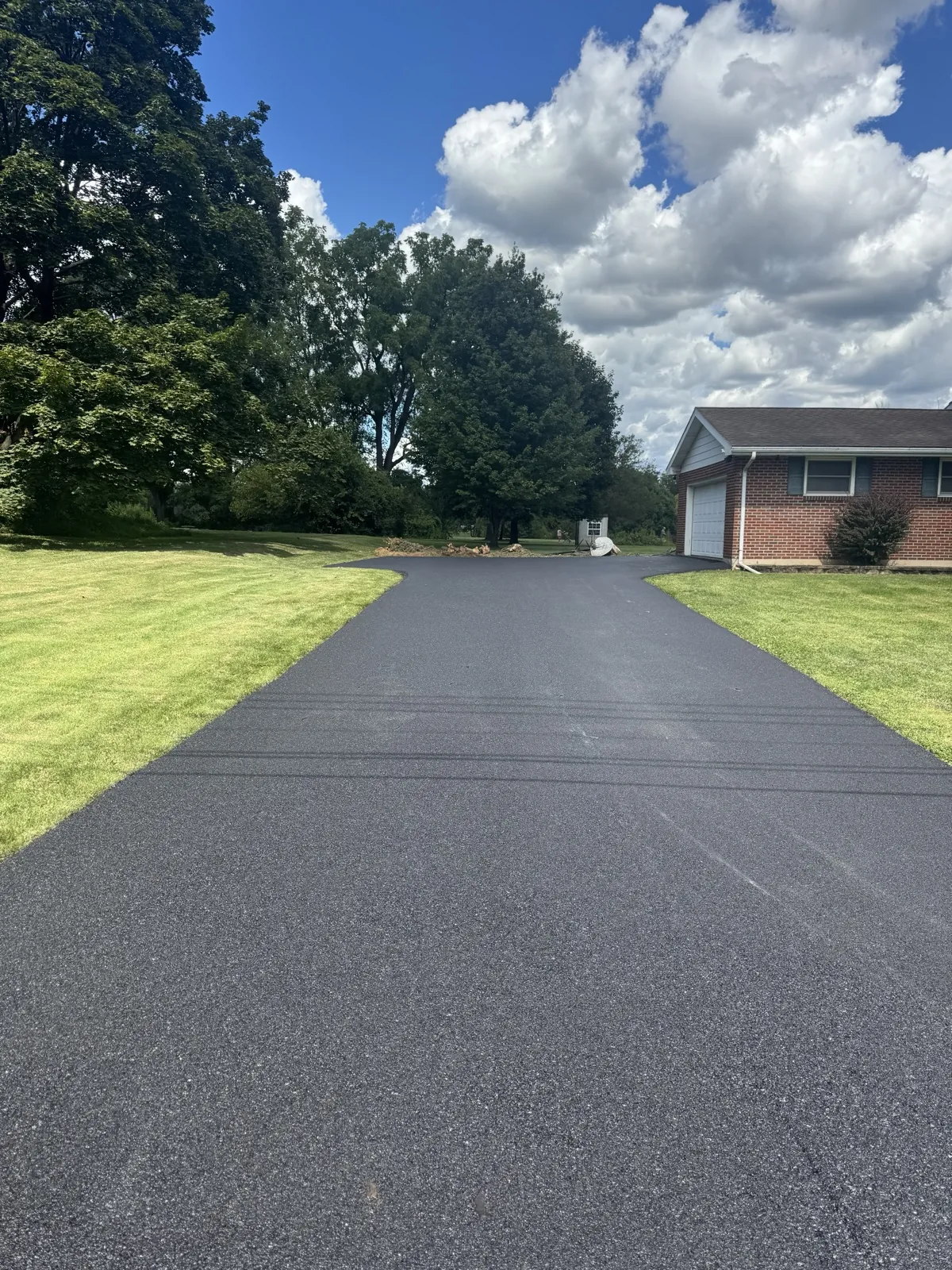 Driveway with home + red building, All County Paving NJ and PA