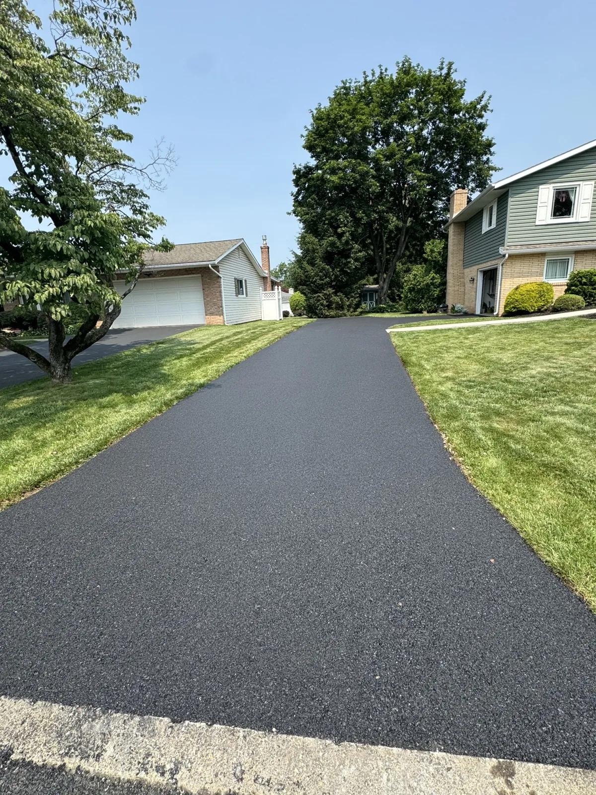 Driveway to two-story home, clean approach, All County Paving NJ and PA