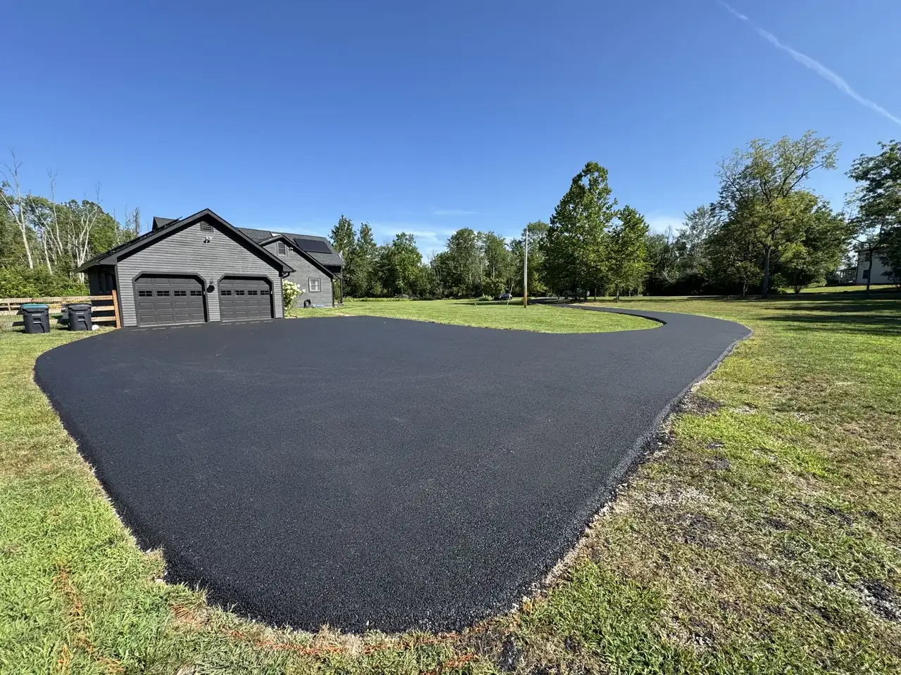 Wide finished blacktop in front of home, paved by All County Paving in New Jersey