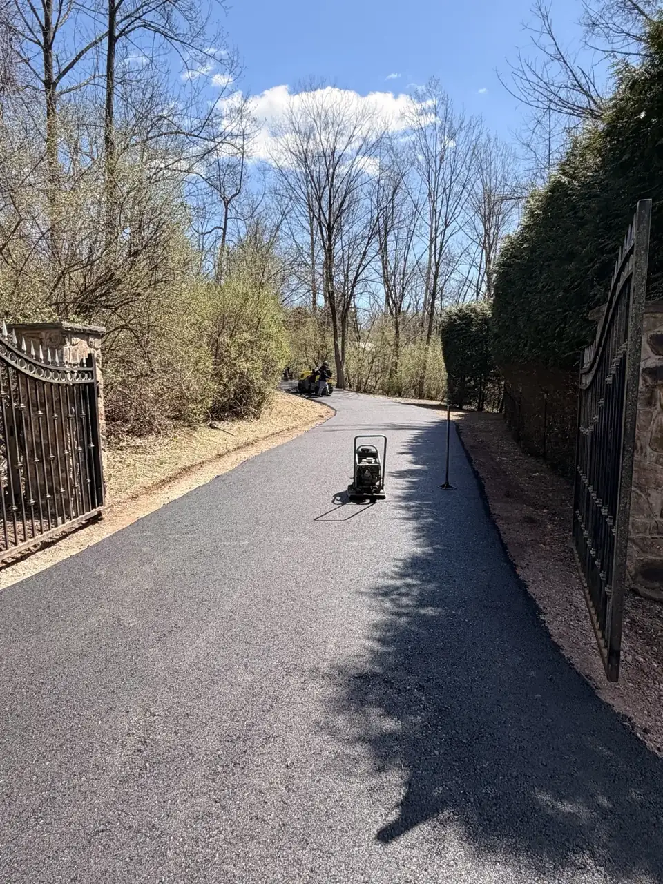 Dark driveway with shadow play, paved by All County Paving in New Jersey