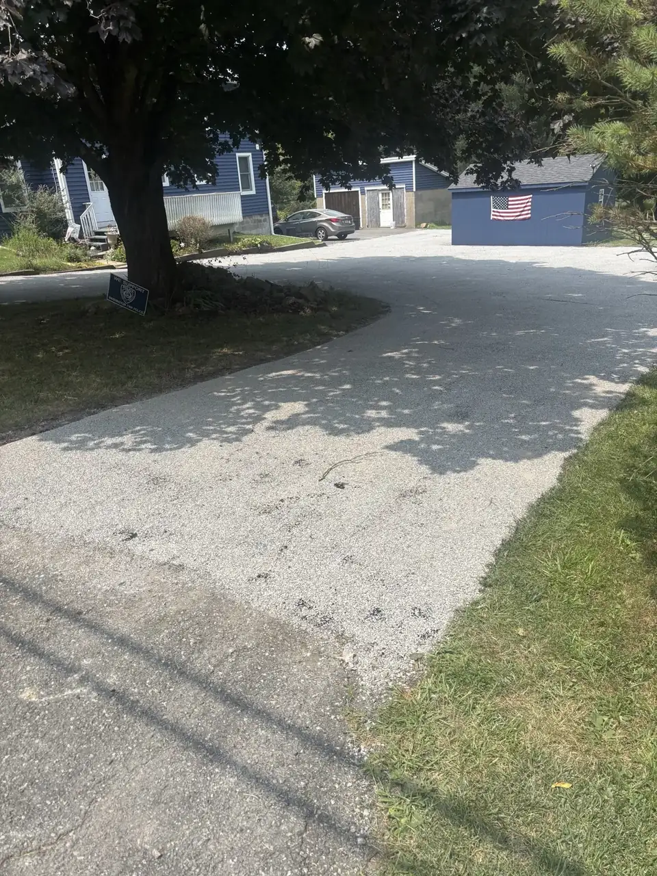 Curving driveway through trees, paved by All County Paving in New Jersey
