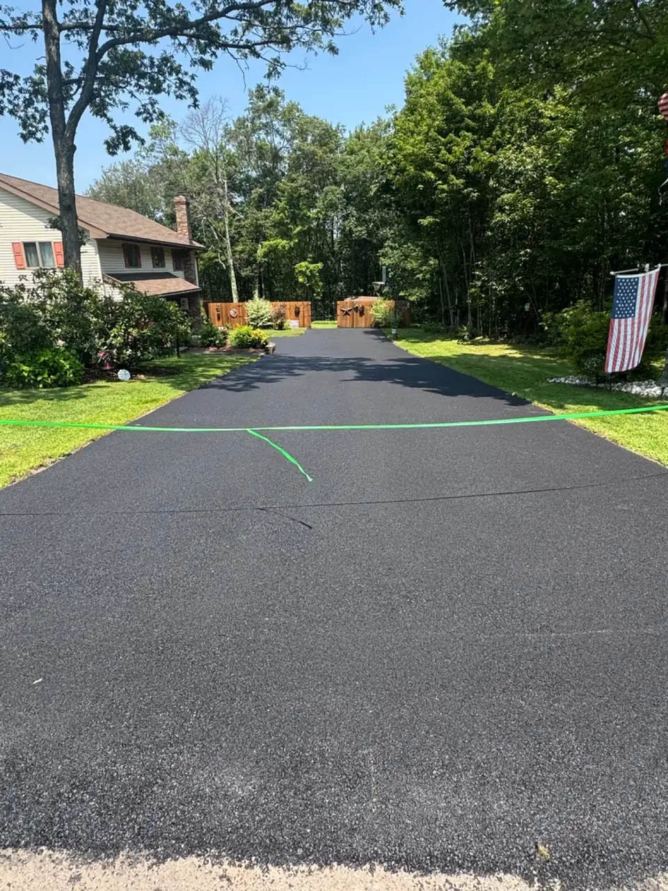 Wide driveway approach to home, paved by All County Paving in New Jersey