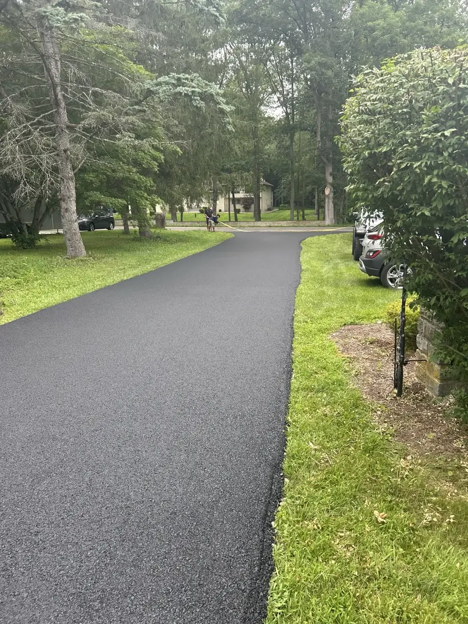 Driveway with shadows from the trees, paved by All County Paving in New Jersey
